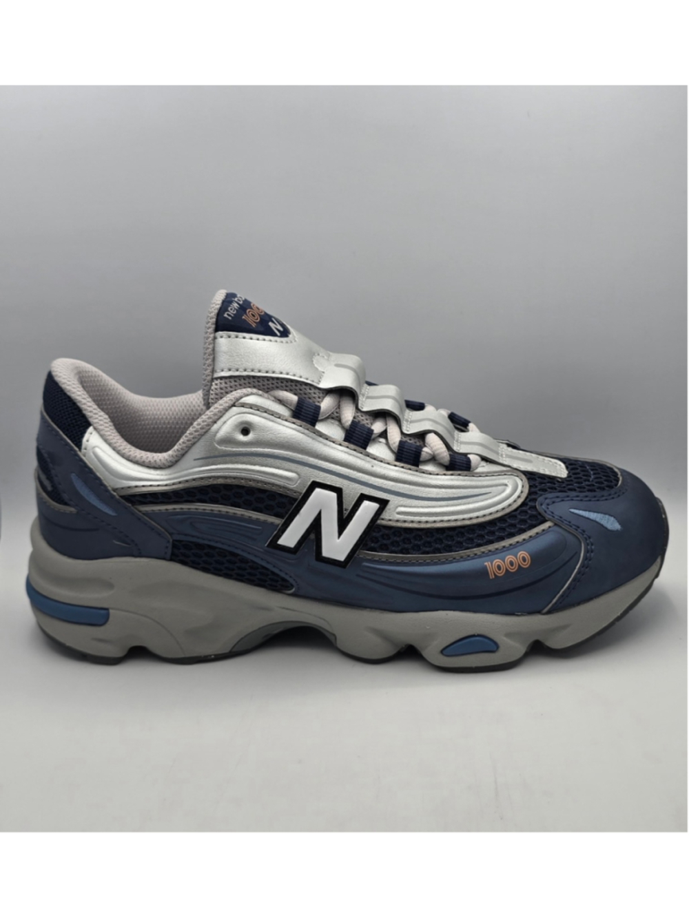 New Balance 1000 Sneakers Blue and Silver women’s 6.5 kids 5y
